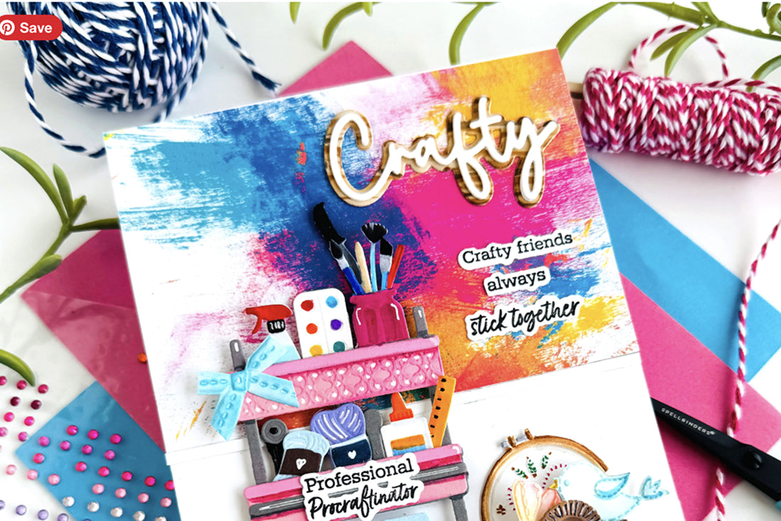 Colorful craft planner with 'Crafty' on a white background with craft supplies.